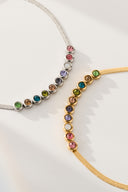 Rainbow bracelet with colorful bezel set stones in a minimalist tennis bracelet style, shown as a delicate bracelet for women. Multicolor stone bracelet designed for stacking, everyday wear, and gift giving with bright gemstone inspired colors.