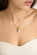 Personalized freshwater pearl birthstone necklace featuring a natural pearl charm paired with a custom birth month gemstone. Dainty gold necklace available in 12 birthstone colors including garnet, amethyst, aquamarine, emerald, ruby, sapphire, topaz and more. Minimalist everyday jewelry designed for layering and daily wear. Meaningful personalized gift for women, daughters, sisters, friends and bridesmaids with a timeless and elegant style.
