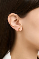 Birthstone stud earrings with baguette cut gemstones in multiple birth month colors, shown as dainty gemstone earrings and birthday gift jewelry for her. Minimalist baguette stud earrings designed as elegant birthstone earrings for everyday wear.