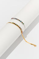 Colorful gemstone bracelet with rainbow tones in a slim modern bracelet setting, photographed as a dainty tennis bracelet for women. Multicolor bracelet ideal for gift for her searches, birthday jewelry, anniversary gift ideas, and everyday styling.