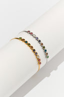 Rainbow bracelet with colorful bezel set stones in a minimalist tennis bracelet style, shown as a delicate bracelet for women. Multicolor stone bracelet designed for stacking, everyday wear, and gift giving with bright gemstone inspired colors.