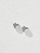 Textured heart stud earrings in gold and silver with a sculptural hammered finish, shown as minimalist heart earrings for women. Gold heart earrings and silver heart studs displayed as romantic gift jewelry, everyday stud earrings, and modern heart shaped earrings with a soft reflective surface.