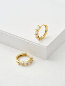 Silver plated baguette crystal hoop earrings product shot on grey background – AURA Jewelry