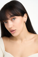 Model wearing gold baguette crystal hoop earrings – AURA Jewelry