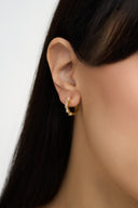 Gold plated baguette crystal huggie hoop earrings on white fabric – AURA Jewelry